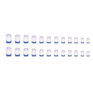 Klein blue French press-on nails set with 24 gradient glitter pieces on white background