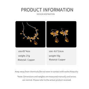 Details zum Schmetterling-Schmuckset aus Kupfer mit Bernstein-Anhängern und Zirkonia