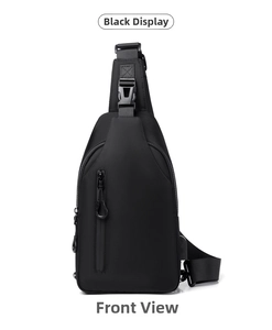 Front view of black waterproof chest bag featuring a vertical zipper and USB charging port