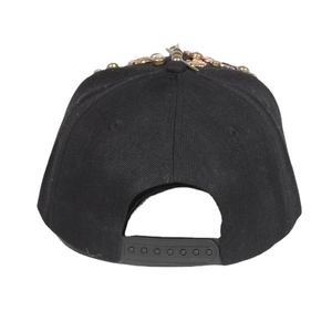 Black snapback hat with gold metal rivets and adjustable plastic closure on back view