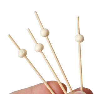 Set of four 12cm bamboo fruit skewers with decorative small red beads on white tips