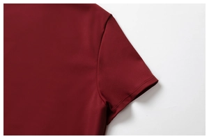 Macro detail of wine red yoga top shoulder and sleeve with double needle stitching