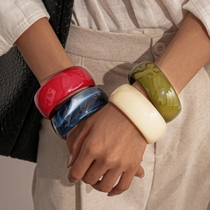 Vintage chunky acrylic resin bangles in red, marble blue, beige, and olive green colors