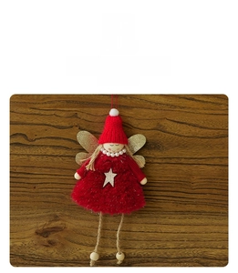 Detail of Christmas angel plush pendant with red knit hat and golden glitter wings