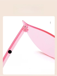 Close-up of pink frameless sunglasses with durable TR material hinge and lens detail