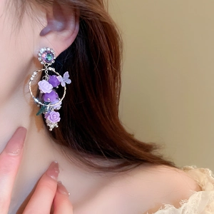 Boucles d'oreilles élégantes en cristal violet rose papillon avec pompons