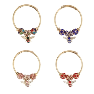 Gold spiral bracelets set with colorful zircon beads and exquisite bee charms for women