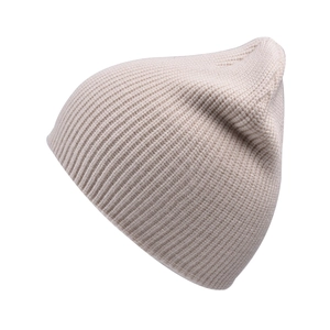 Close-up of beige knit beanie showing the detailed ribbed texture and soft thick fabric