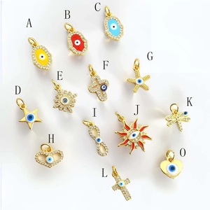 Macro shot of gold-plated evil eye charms with micro-inset zircons for jewelry making