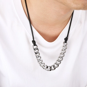 Men's silver Cuban chain necklace with black wax cord on a male model neck