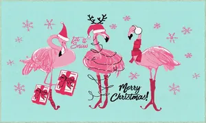 Detail of Christmas doormat with pink flamingos and Let it Snow festive text design