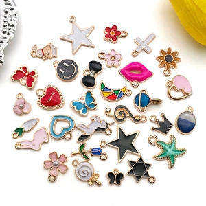 Macro view of colorful enamel DIY alloy pendants in various shapes like heart and star