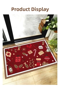 Macro view of Christmas festive entrance mat on wood floor featuring holiday patterns