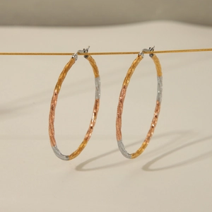 Three-tone 18K gold-plated stainless steel twisted hoop earrings in gold silver rose gold