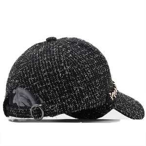 Women's black tweed baseball cap with metallic thread and gold chain detail