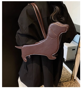 Detail view of the dachshund dog shaped shoulder bag in premium dark brown faux leather
