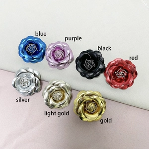 Detailed collection of PU leather camellia pins in gold, silver, red, and blue colors