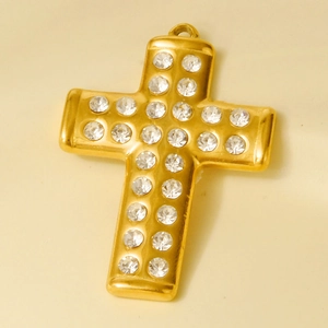 Close-up of gold stainless steel cross pendant featuring multiple small inlaid diamonds