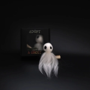 Handmade white felt ghost doll in a black Adopt A Ghost gift box for Halloween decor