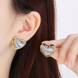 Two-tone 18K gold plated heart stud earrings with a textured wavy silver inner design