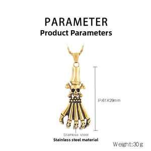 Macro detail of gold stainless steel skeleton hand pendant with dimension parameters