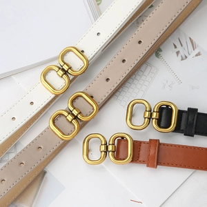 Flat lay of slim PU leather belts in white, beige, black, and brown with gold double ring buckles