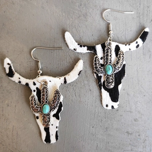 Western style cow skull earrings with faux cowhide pattern and turquoise cactus charm