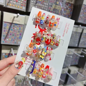 Detail of 5D embossed nail stickers featuring festive Chinese characters and 3D charms