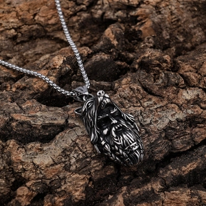 Retro Viking berserker wolf helmet pendant with steel box chain on tree bark
