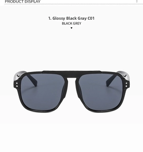 Detailed front view of black oversized sunglasses with double bridge and silver rivets
