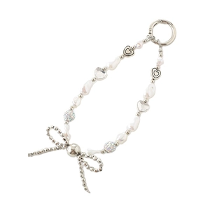 Beaded phone charm with pearls, rhinestones, and silver bow on white background
