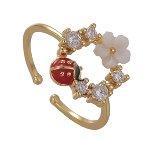Floral open ring with white flower, enamel ladybug and sparkling zircons in gold finish