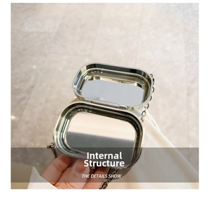 Detail showing internal mirror structure and silver chain of this acrylic mini bag