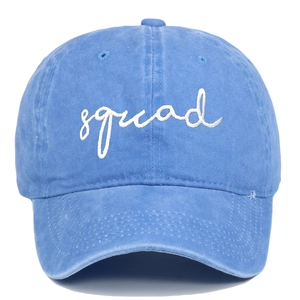Close-up of blue washed cotton baseball cap featuring white squad embroidery detail