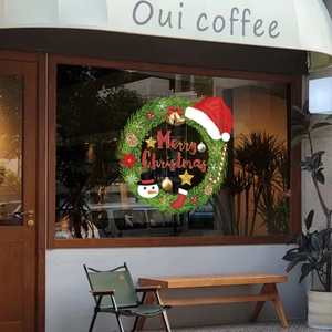 Green Christmas wreath window sticker with snowman and Merry Christmas text decor