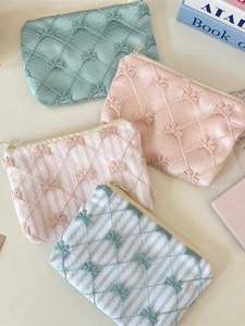 Pastel lace floral coin purses with quilted bow patterns and zipper closures
