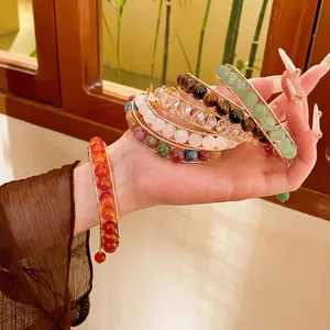 Handmade tiger eye and crystal beaded wire wrap bangles in luxurious gold finish