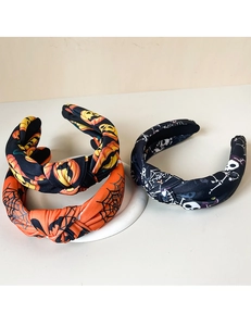 Detailed set of three Halloween headbands featuring pumpkin, spider web, and skull patterns