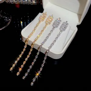 18K gold plated tassel earrings with marquise zircon crystals on a jewelry gift box