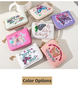 Detail of mini butterfly embossed PU wallets with gold clover zipper pulls in various colors