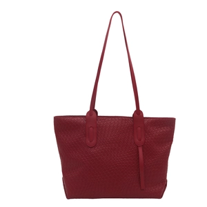 Classic red woven tote bag with large capacity and elegant shoulder straps for women