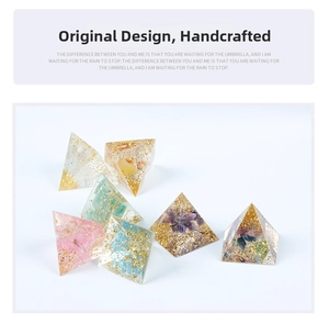 Detailed collection of handmade resin crystal pyramids with gold foil and natural stones