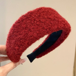 Close-up of vintage burgundy plush headband showing the thick knit texture and soft fabric