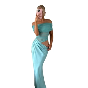 Close-up of light blue off-shoulder maxi dress with waist cut-out and pleated texture