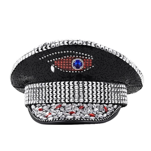Detail of captain hat with black sequins, large evil eye gem and silver rhinestones