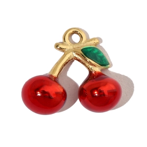 Detailed view of 3D cherry pendant with red fruits and green leaf in golden finish