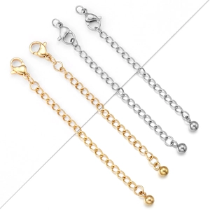 Close-up of 7cm gold and silver extension chains with lobster clasps for jewelry making