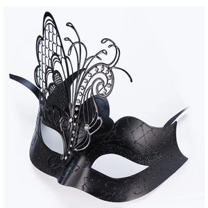 Close-up of black metal butterfly masquerade mask with laser-cut details and rhinestones