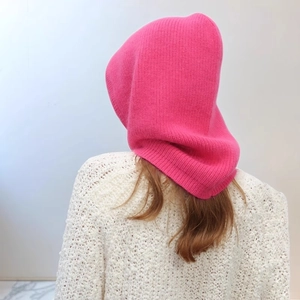 Pink knitted balaclava hood with drawstring showing back view and fine wool texture