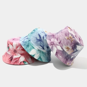 Close-up of floral bucket hats with detailed stitching and colorful patterns
